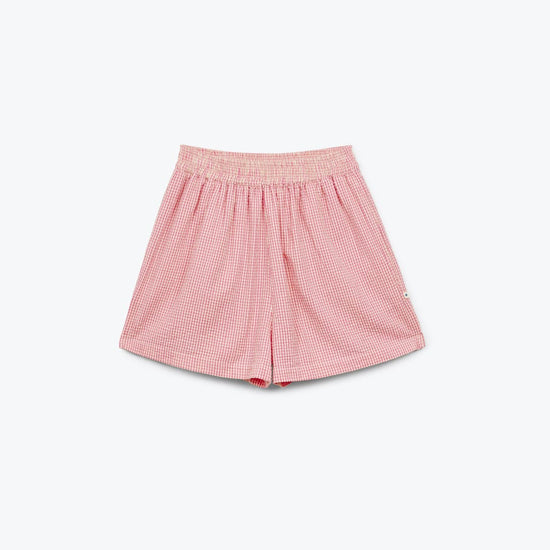 Pink checkered shorts on a white background