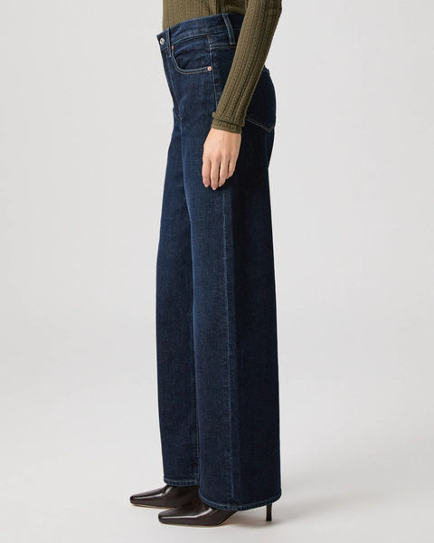 dark blue barrel leg jeans from paige side view