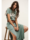Woman wearing green t shirt dress with brown belt from ba&sh