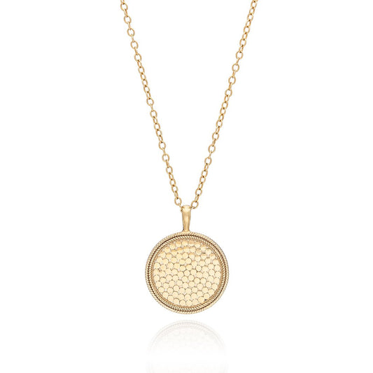 Gold medallion necklace on a gold 30 inch chain