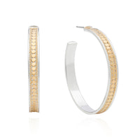 Large hoop earrings with pillar and butterfly fastening with silver base and gold plated dots