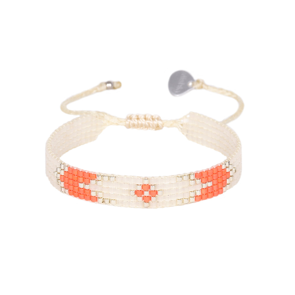 Cream neon orange and silver beaded bracelet