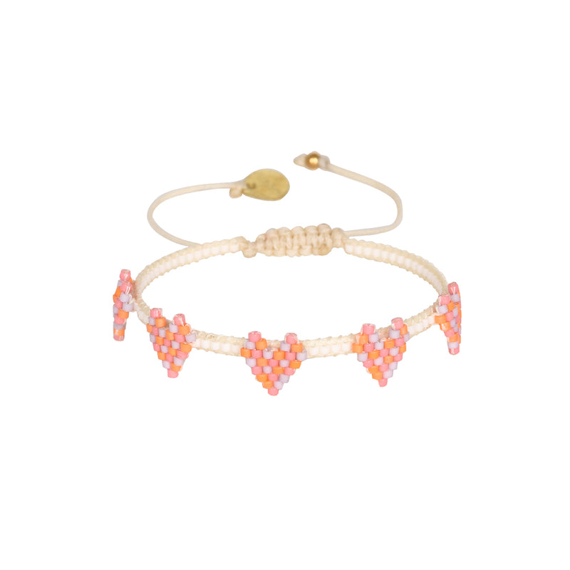 cream beaded bracelet with pink orange and lilac beaded heart details