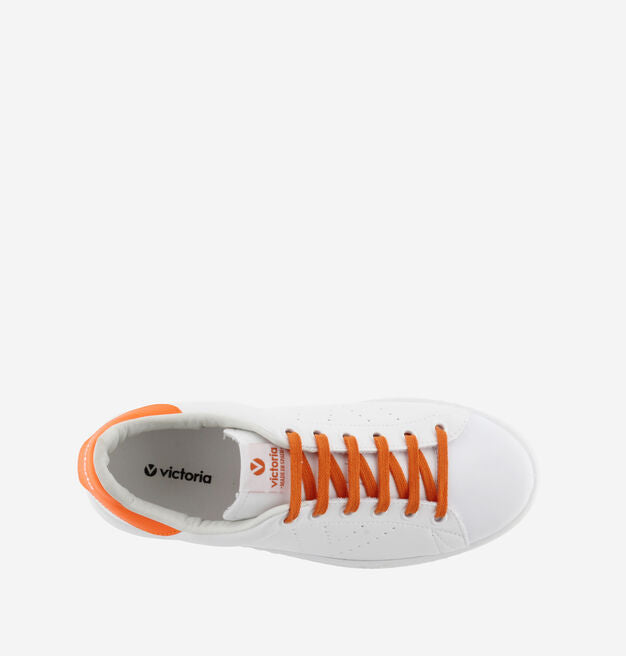 Faux leather white sneakers with orange heel and laces