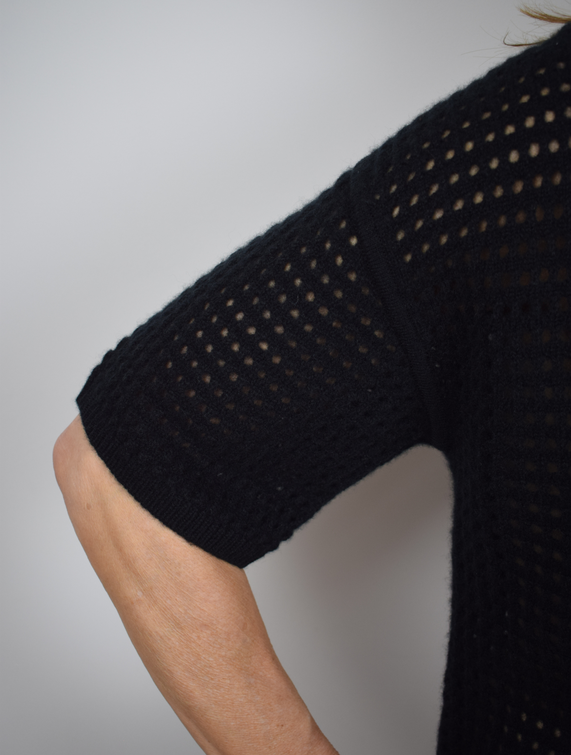 Polo style knitted cream short sleeved jumper in black
