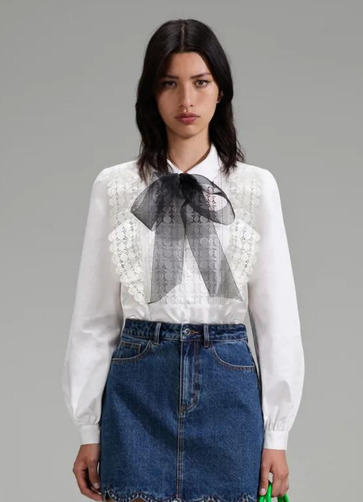 White cotton poplin shirt with classic collar lace ruffles on bodice and long sleeves with detachable black chiffon bow