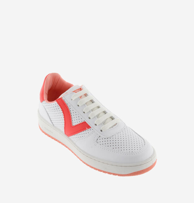 White trainers with neon coral V and heel