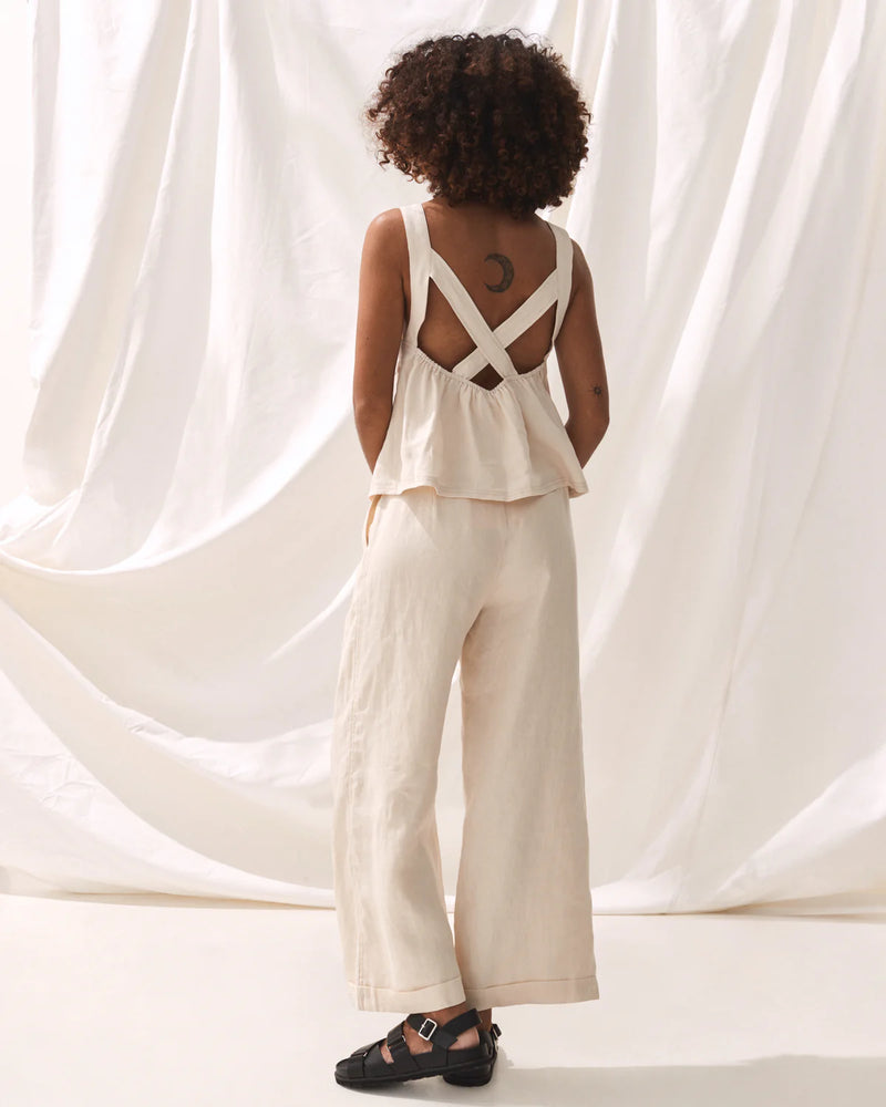 Sleeveless linen top with cross over back and elasticated back in ecru