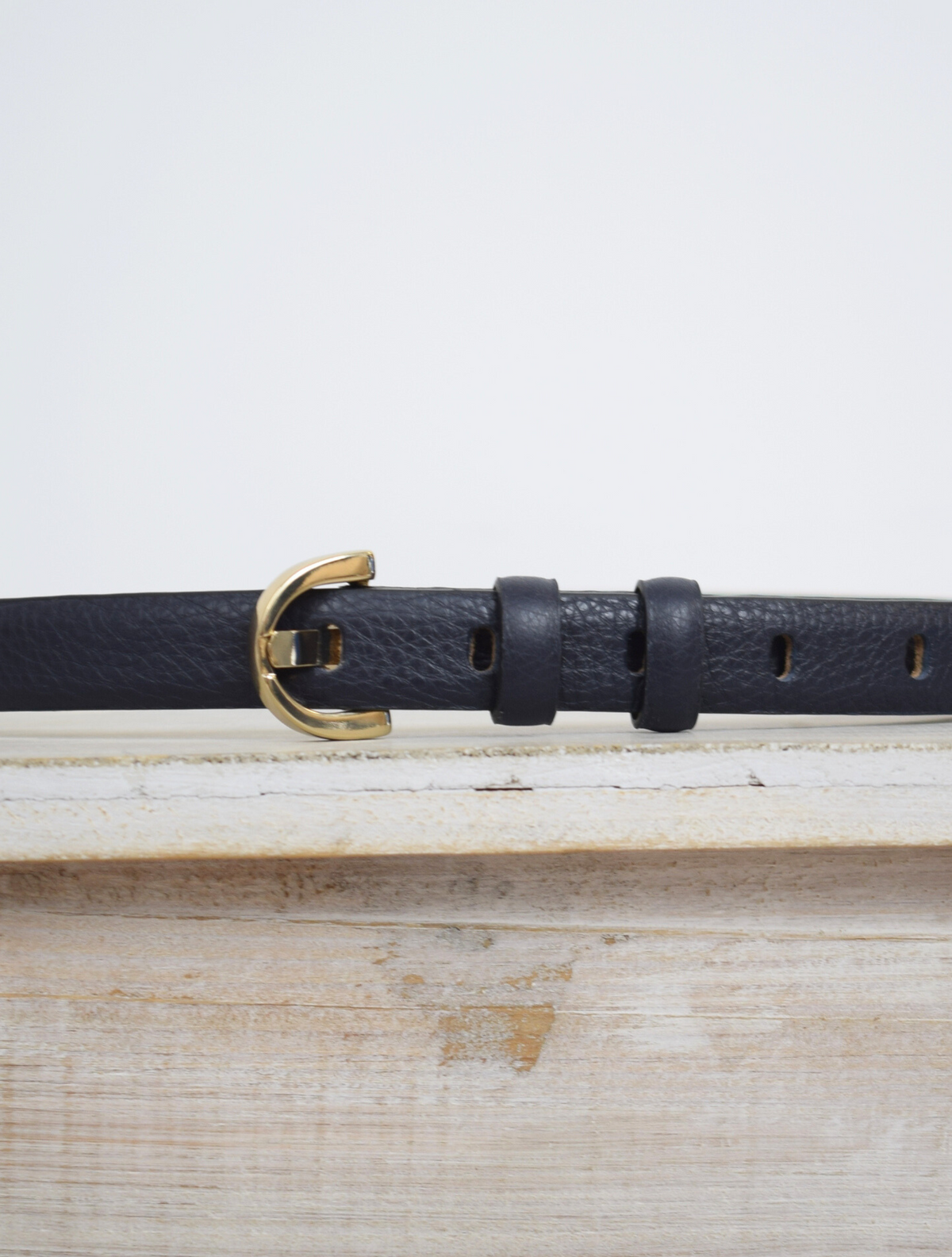 Thin navy leather belt with gold metallic D buckle
