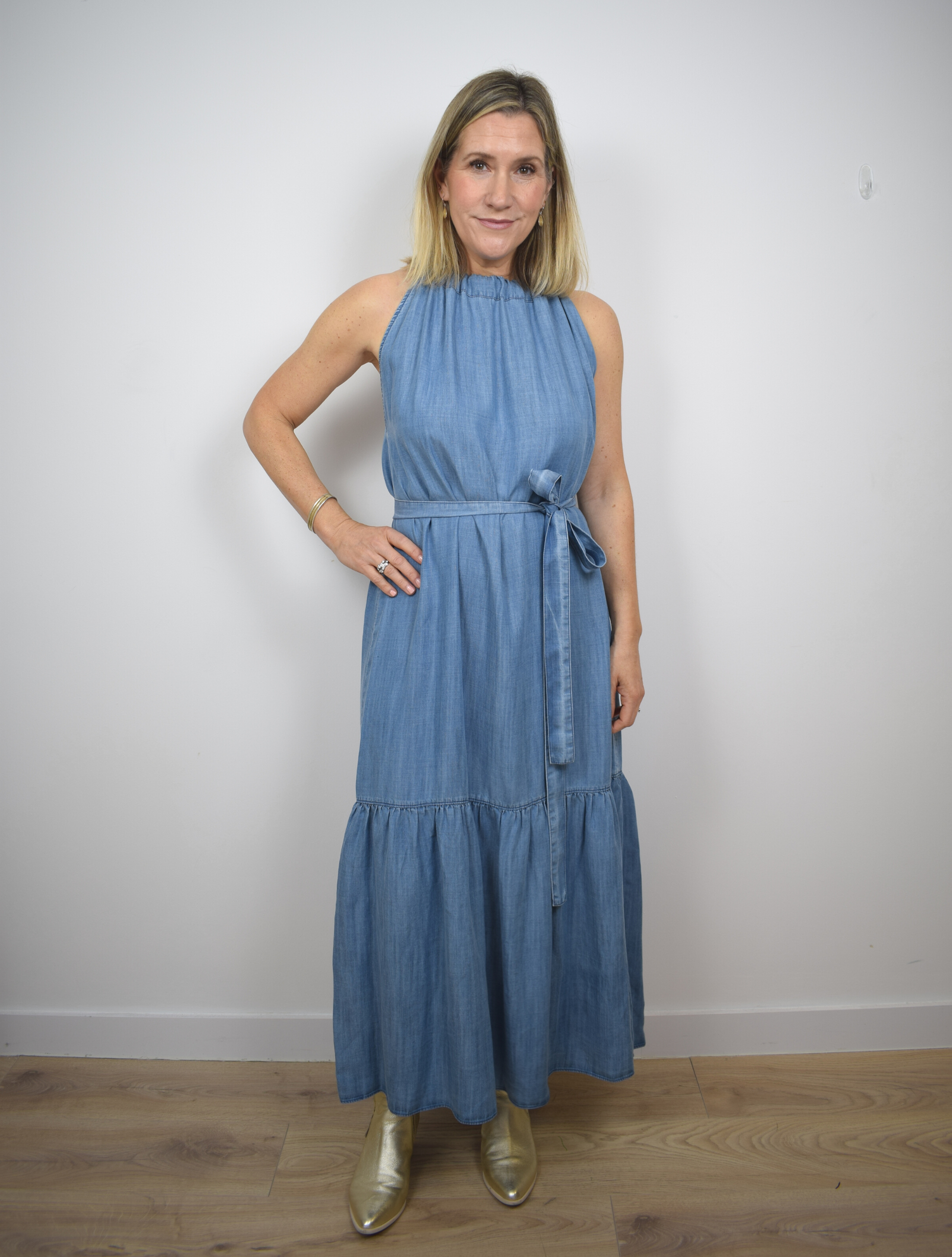 Halterneck light denim long dress with tier ruffle neck and fabric tie belt