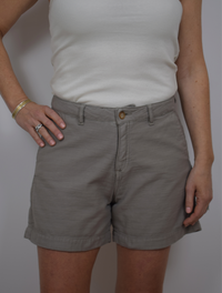 grey mid rise shorts with zipper a button fastening