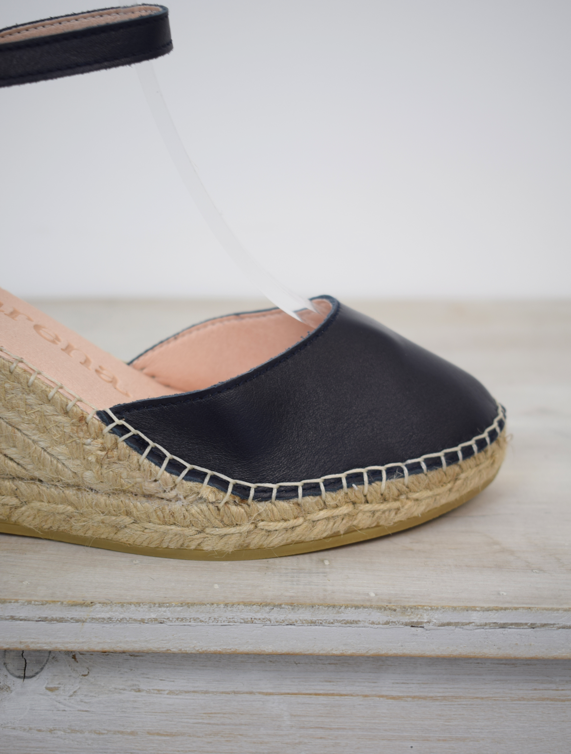 Closed toe navy espadrille with leather upper and strap