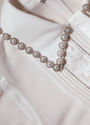 White blouse with rhinestone detail on the collar 