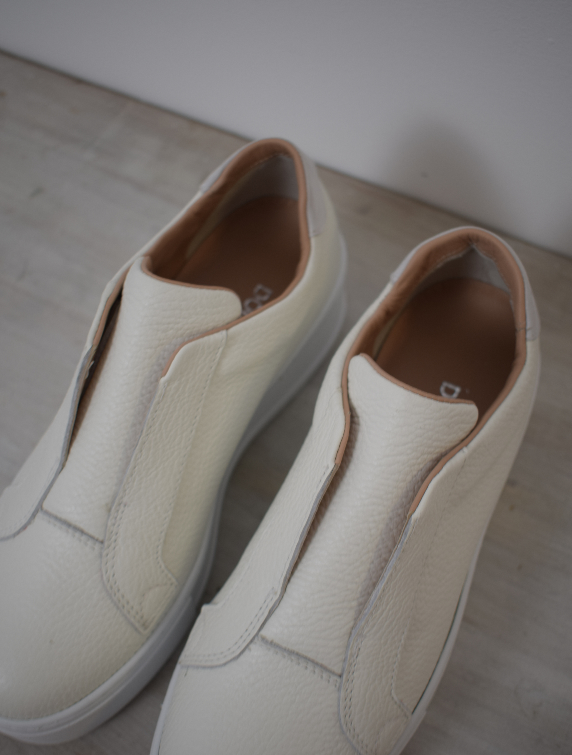 White platform trainers will elasticated side panels to make them easy to pull on