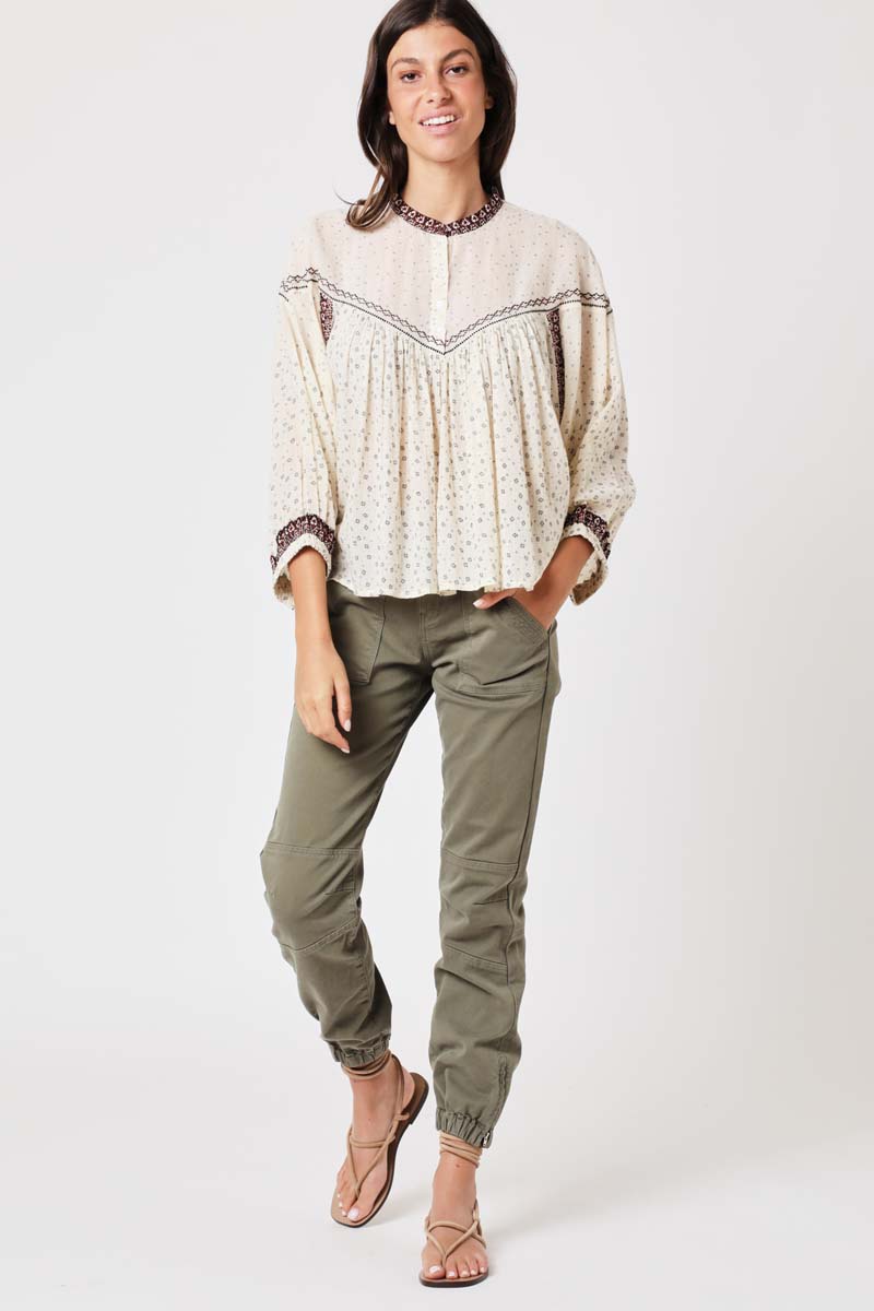 Ecru and brown trim oversize top with three quarter length sleeves and hal fplacket