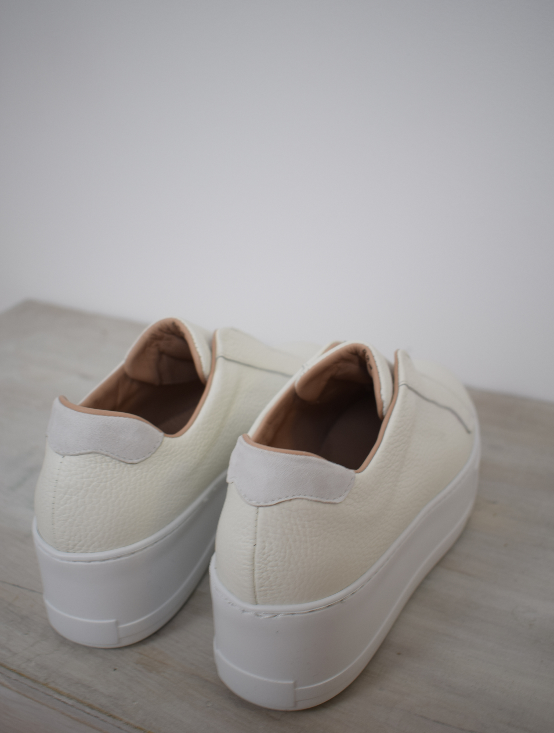 White platform trainers will elasticated side panels to make them easy to pull on