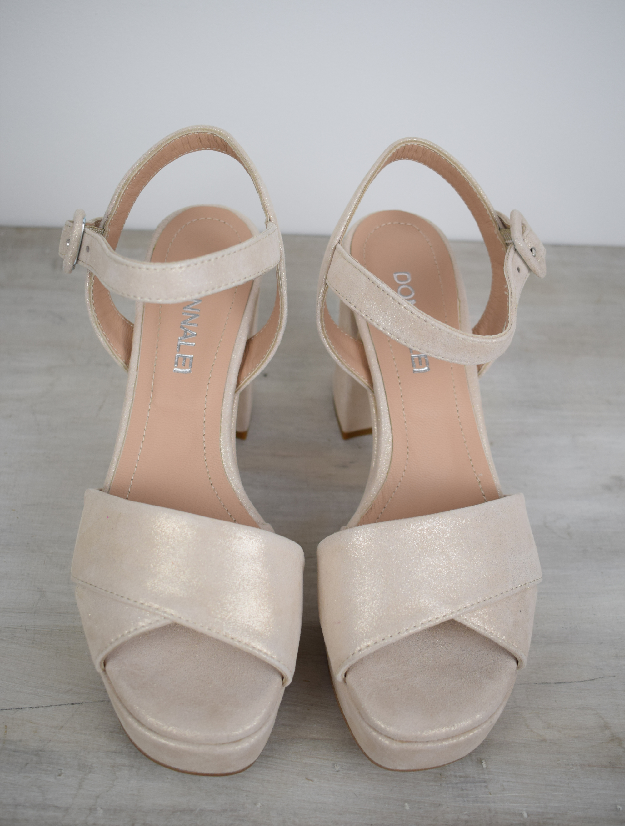 Latte sparkle platform sandal with cross straps and ankle strap with buckle fastening