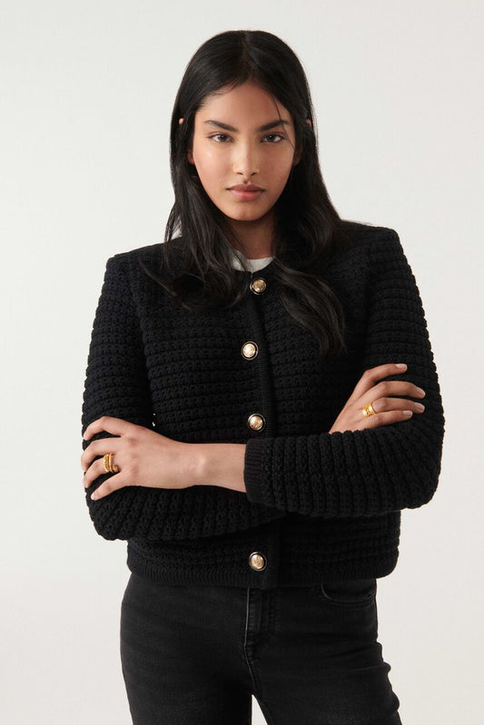 Cropped black chunky knitted cardigan with gold and enamel buttons crew neck and slightly cropped sleeves