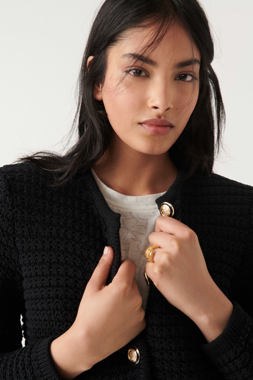 Cropped black chunky knitted cardigan with gold and enamel buttons crew neck and slightly cropped sleeves