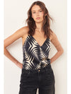 Black and ecru camisole top with spaghetti straps which cross over at the back