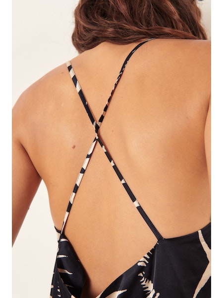 Black and ecru camisole top with spaghetti straps which cross over at the back