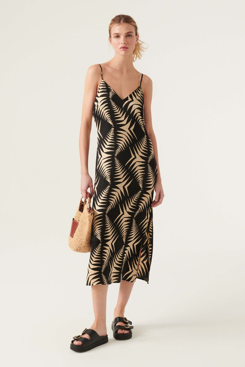 V neck satin look slip dress with geometrical pattern in black and taupe midi length with adjustable spaghetti straps with a horizontal strap at the back