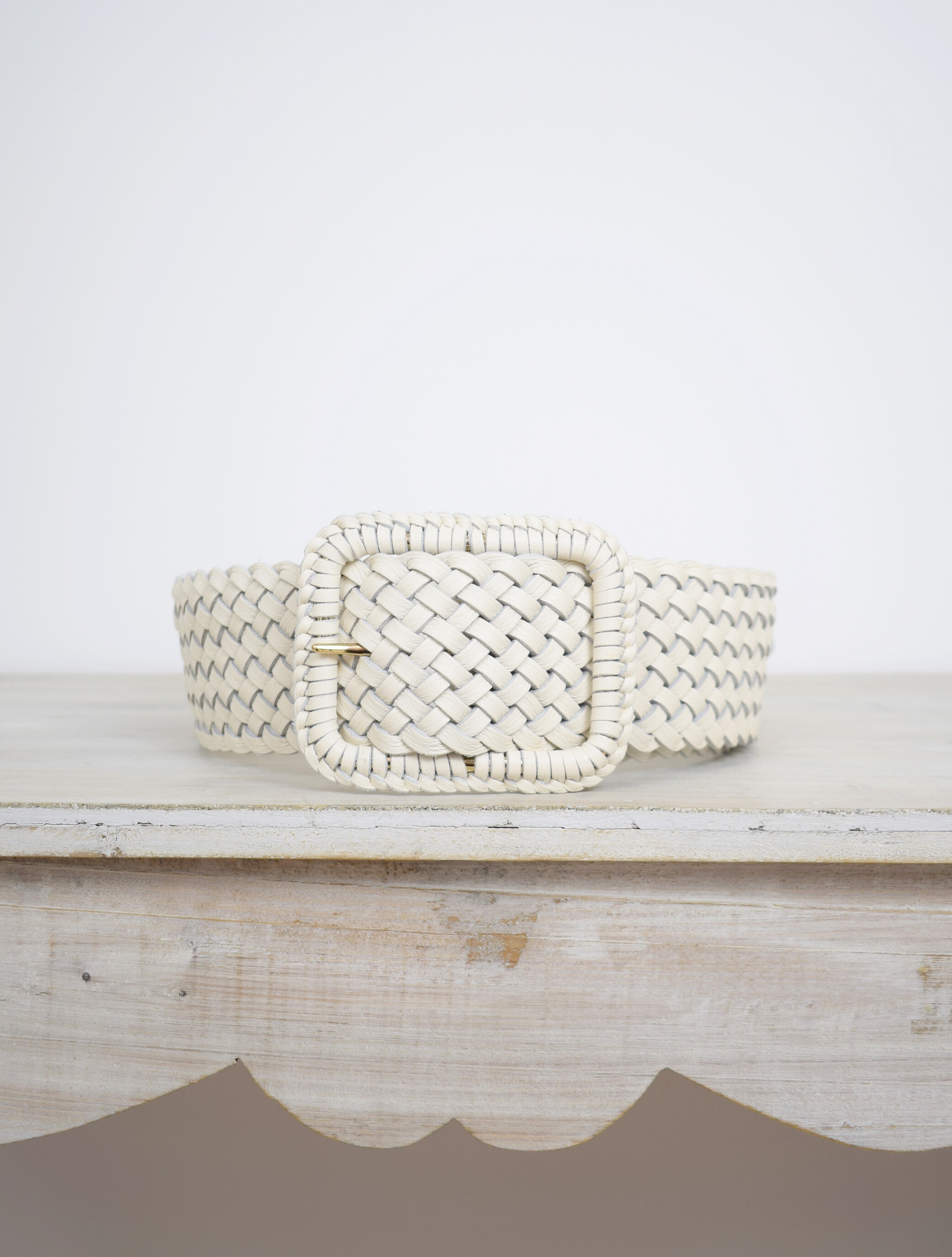 Wide plaited ivory leather belt with oblong leather bound buckle