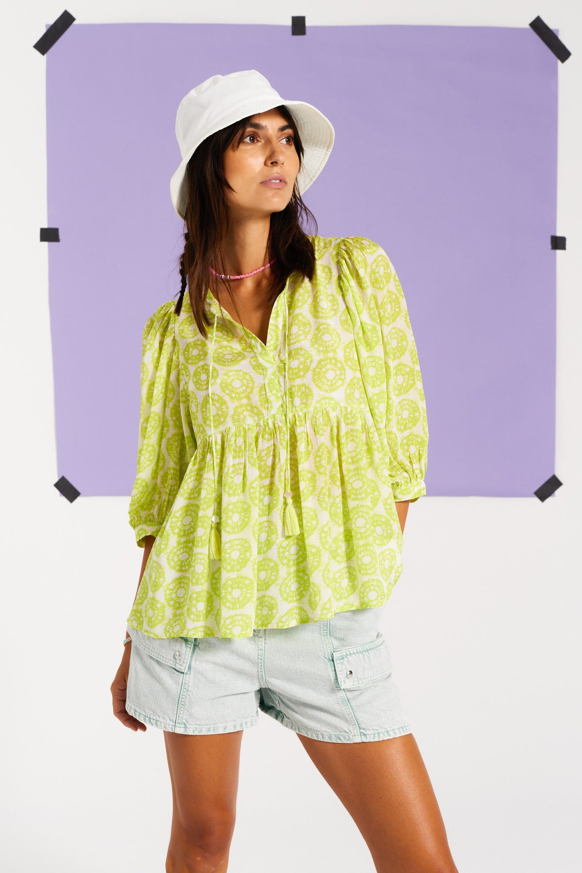 Lime green top with three quarter length sleeves and neck tie