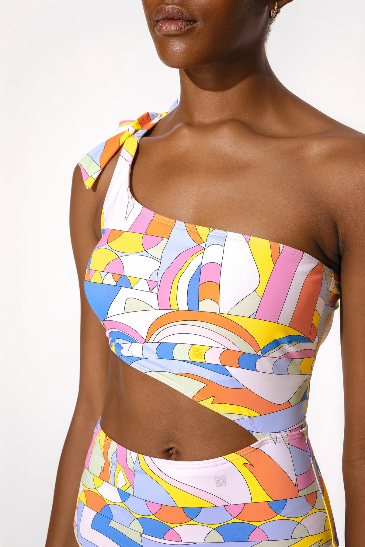 Bold coloured one shoulder swimming costume with cut out details