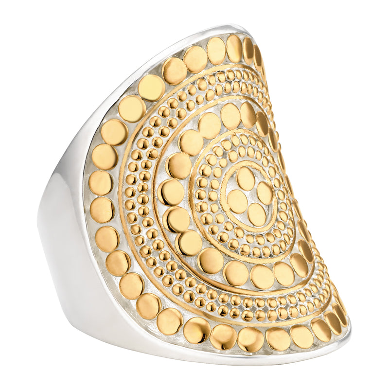 Silver base ring with large disc featuring small gold dots