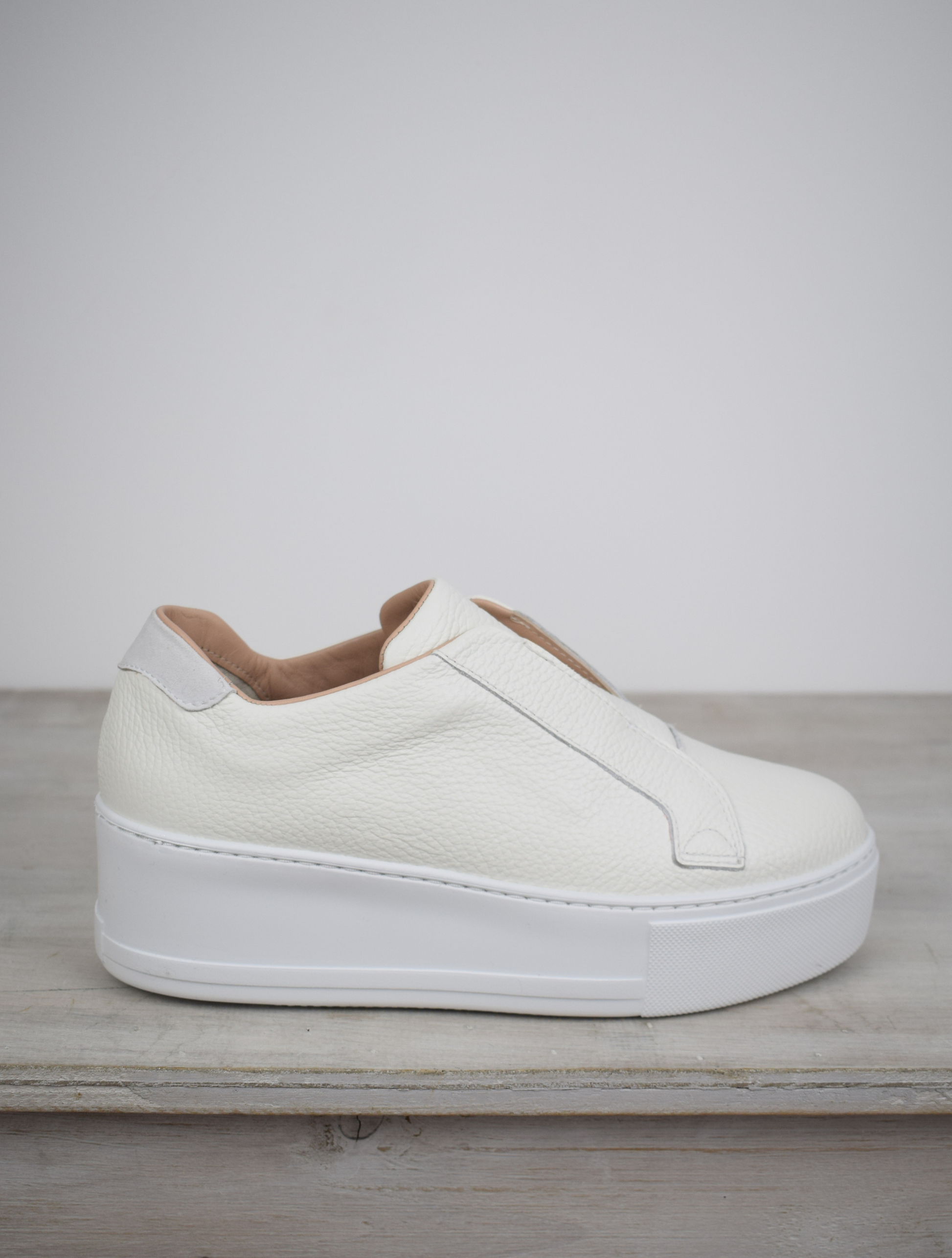 White platform trainers will elasticated side panels to make them easy to pull on