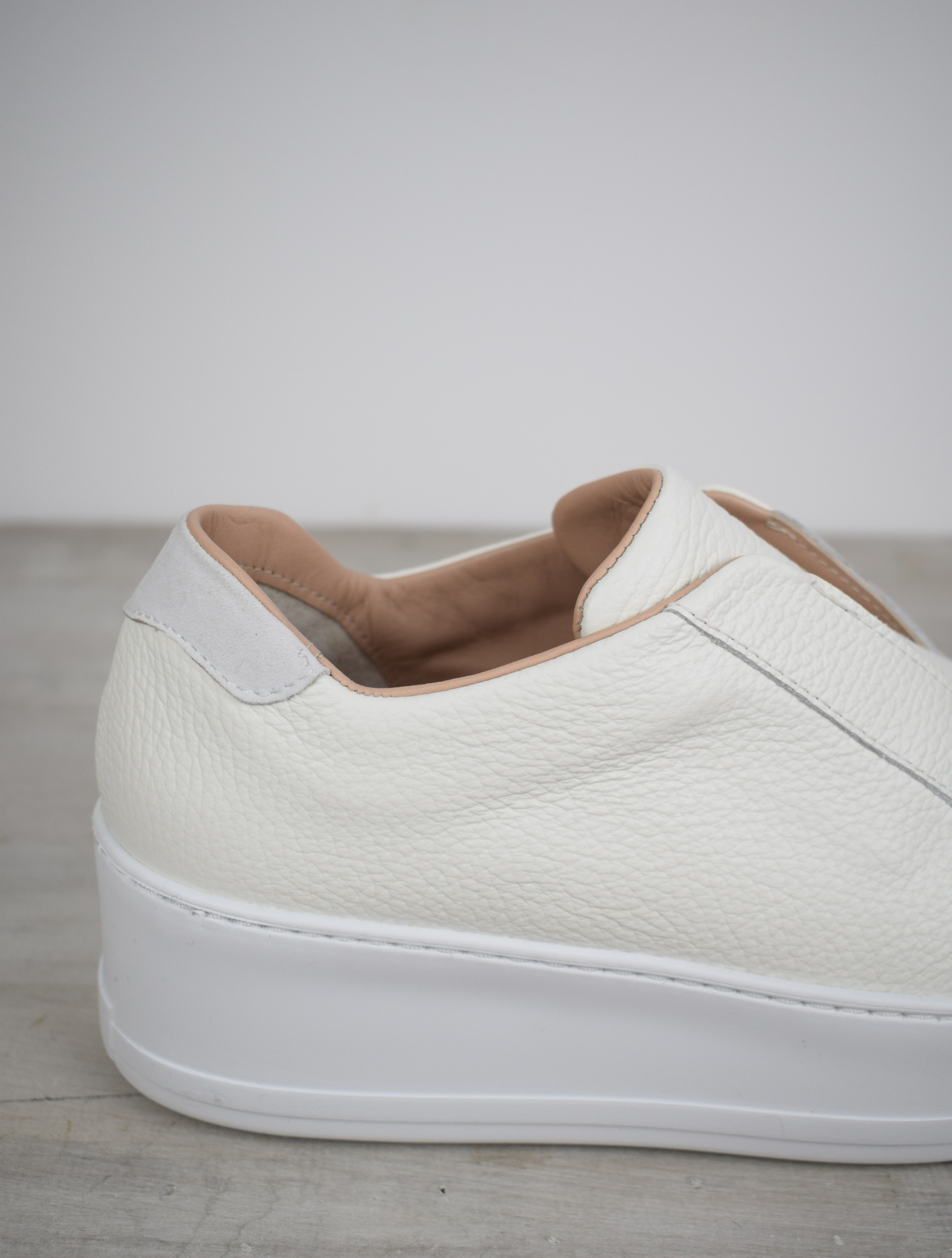 White platform trainers will elasticated side panels to make them easy to pull on