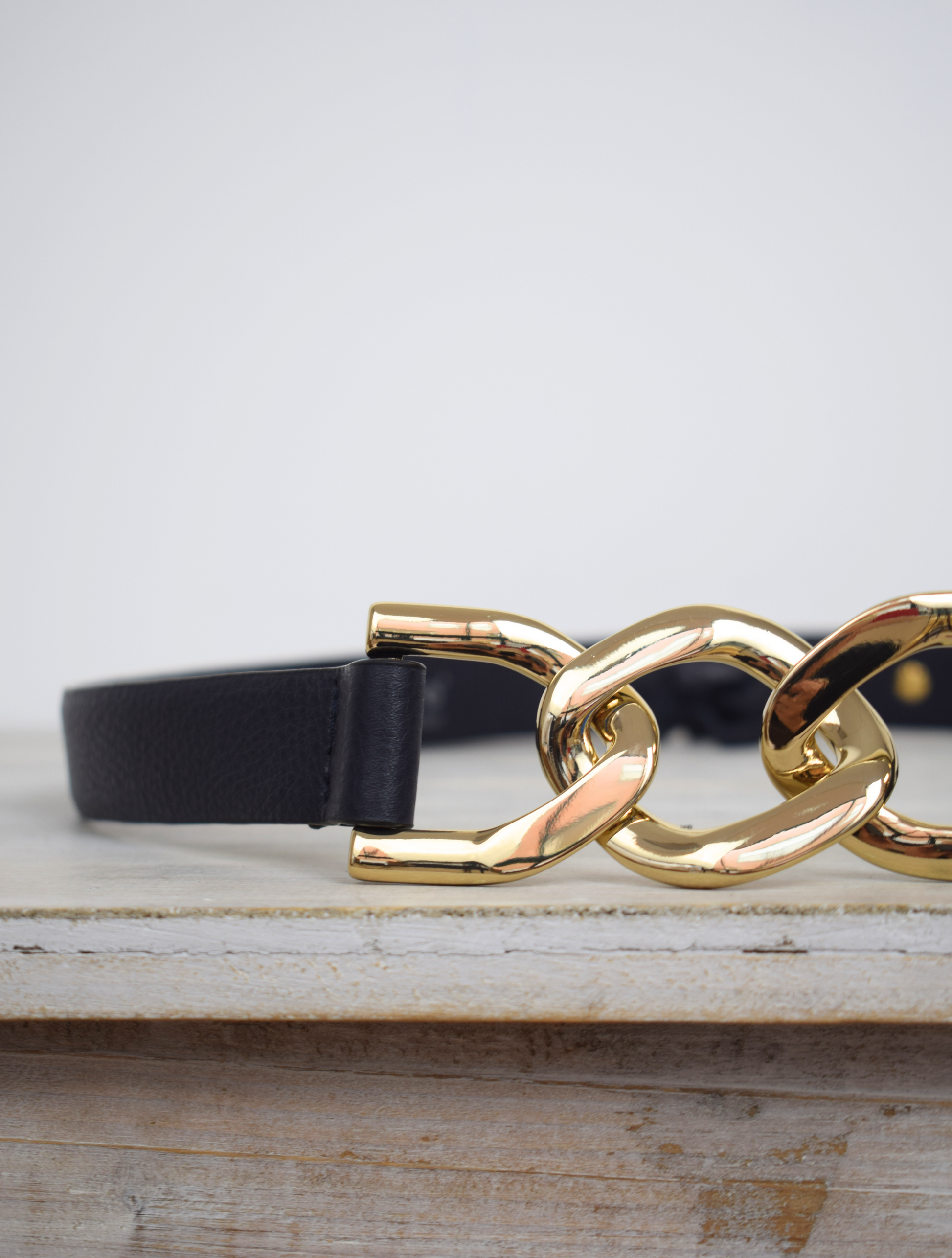 Black link chain belt with gold metallic hardware