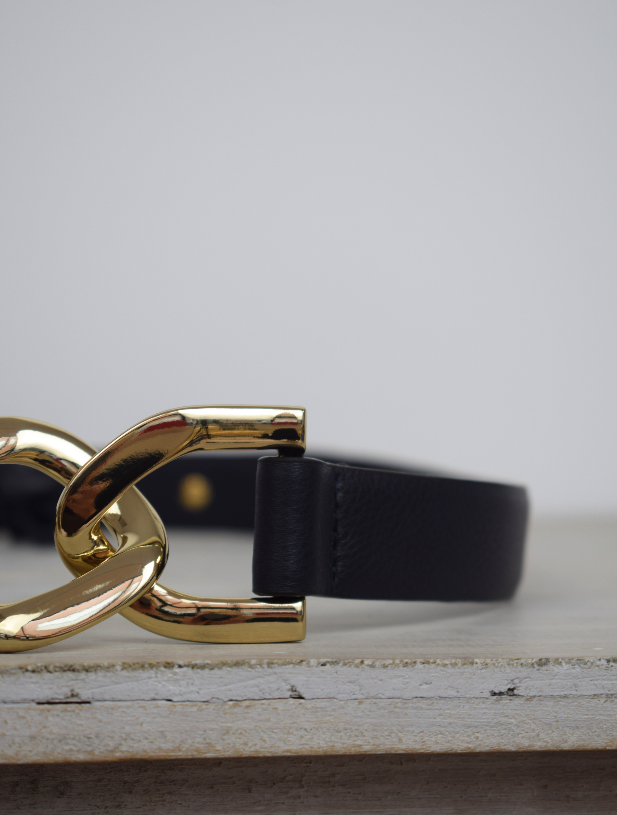 Black link chain belt with gold metallic hardware