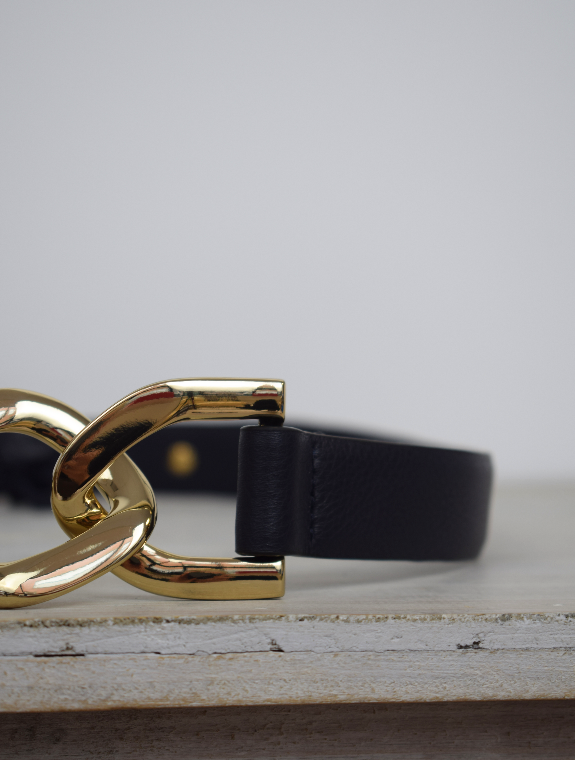 Black link chain belt with gold metallic hardware