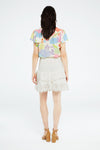 Ecru top with ruffle collar with colourful floral all over print