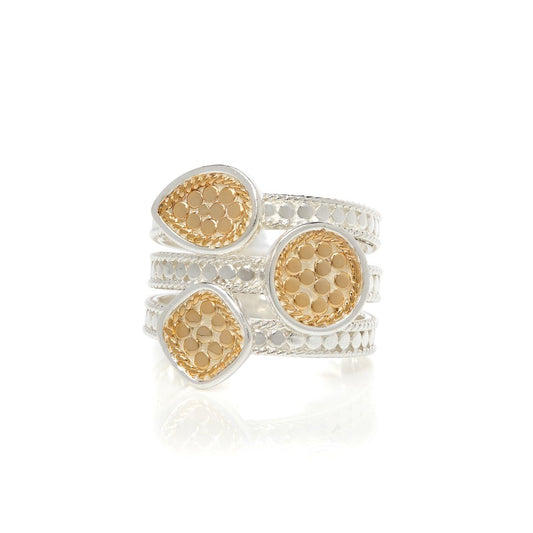 Silver ring with dotted details with three shaped gold pendants with dotted gold details