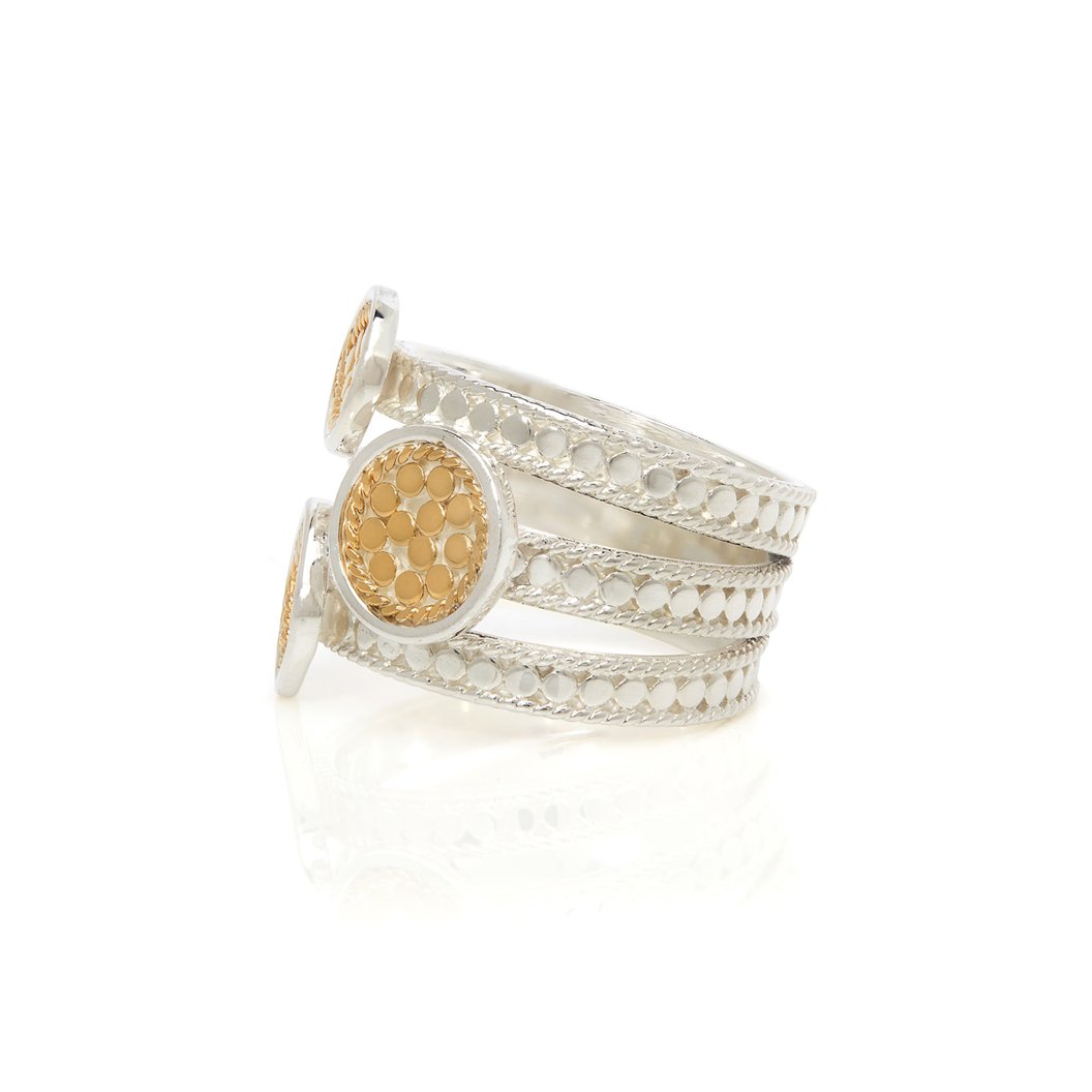 Silver ring with dotted details with three shaped gold pendants with dotted gold details