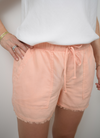 Coral lightweight short with frayed edges