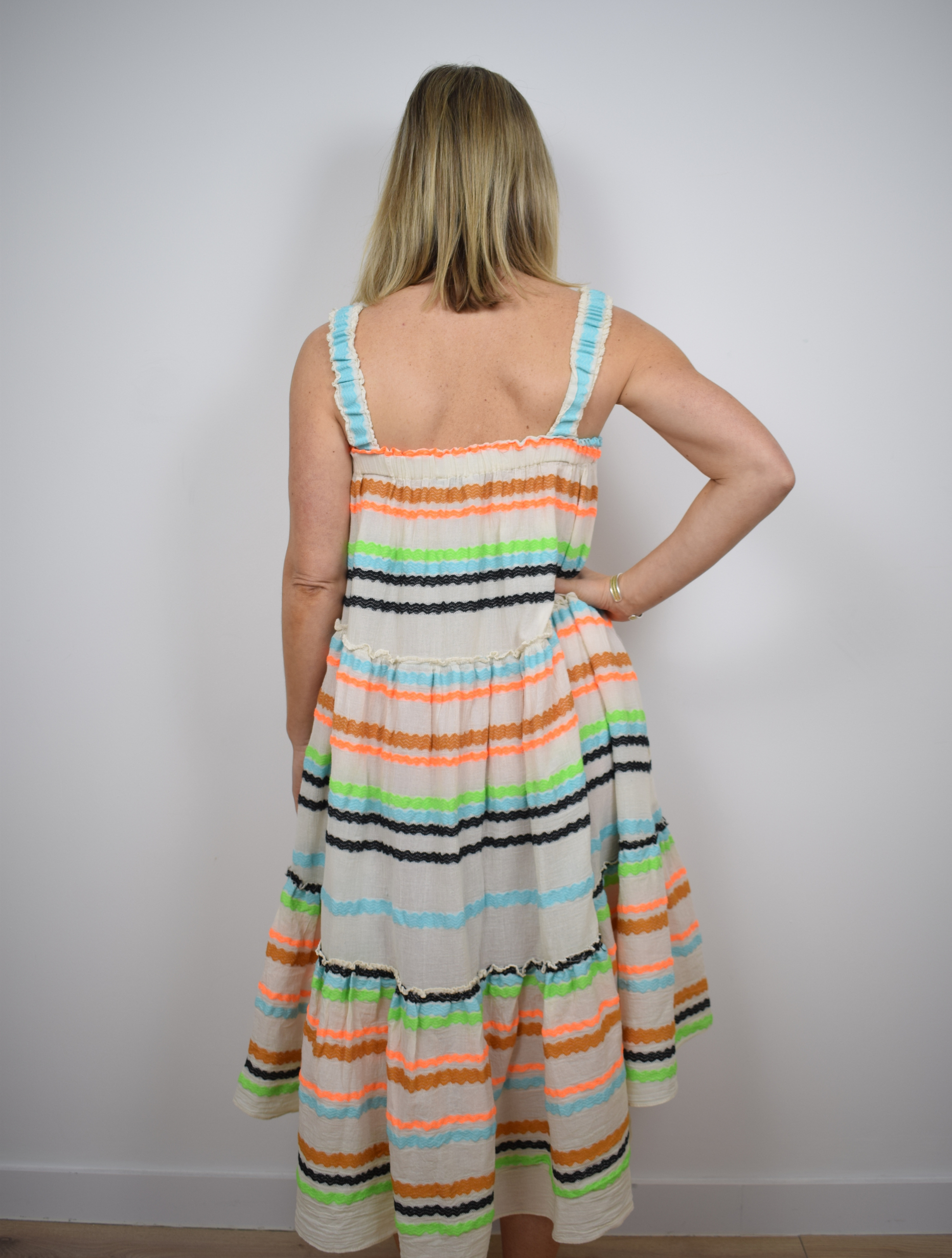 Ecru dress with blue, black, orange and brown frill stripes 