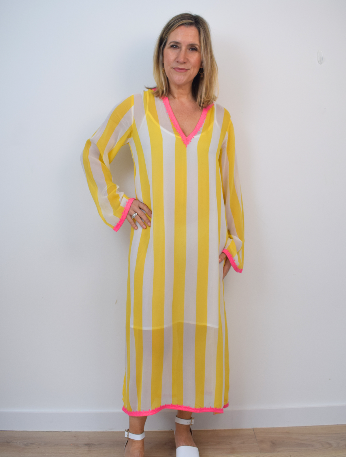 Yellow and white striped v neck dress with pink deatils 