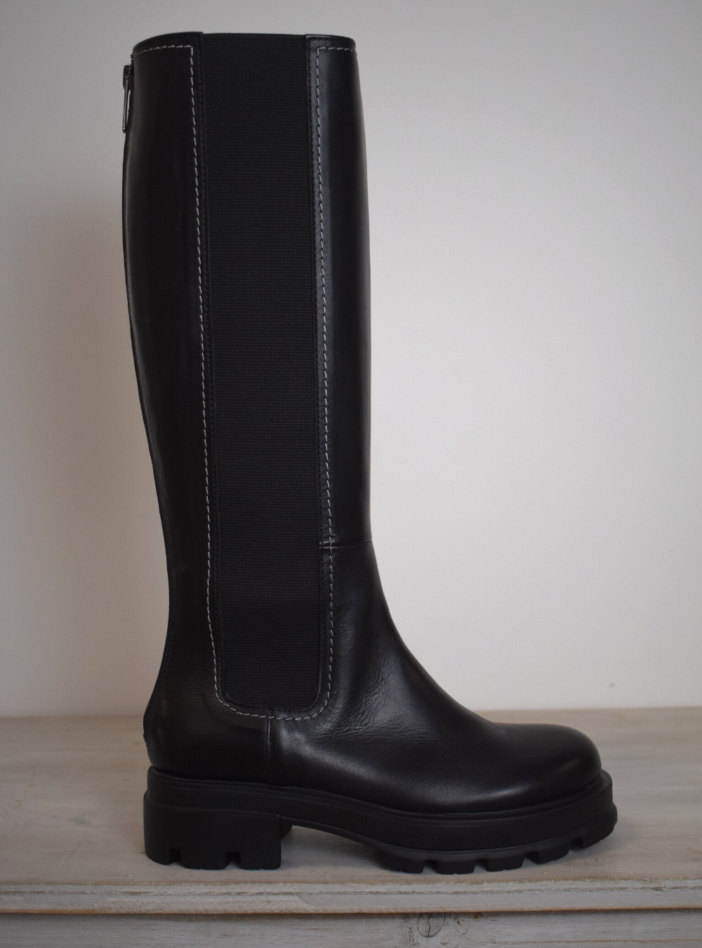Black boot with white edging 