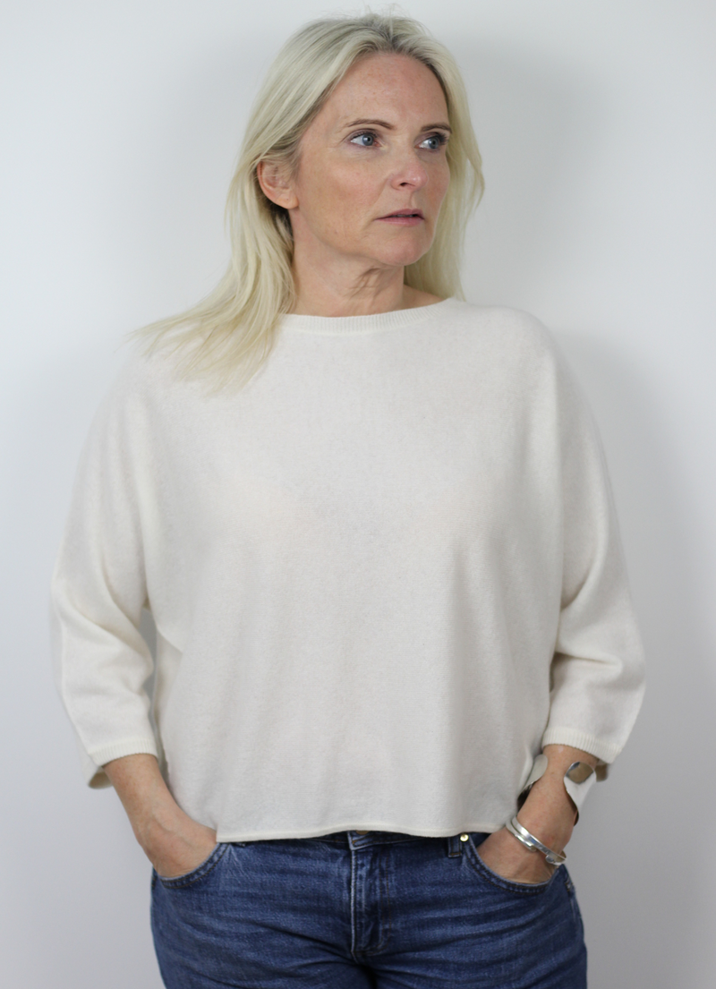 Winter white boxy fit jumper with three quarter length sleeves and five mother of pearl buttons at the back