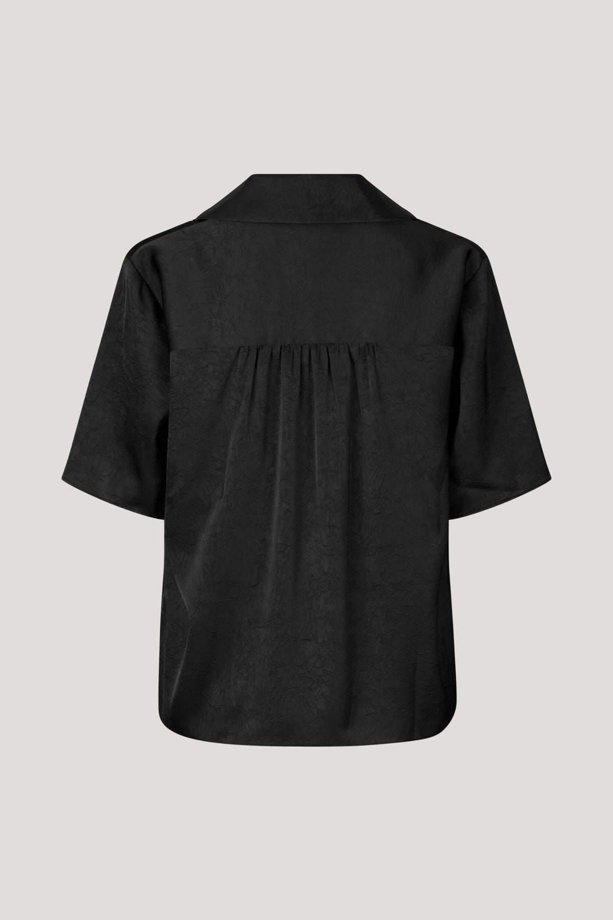 Black crinkle effect fabric top with V neck line and a tie at the neck short sleeves