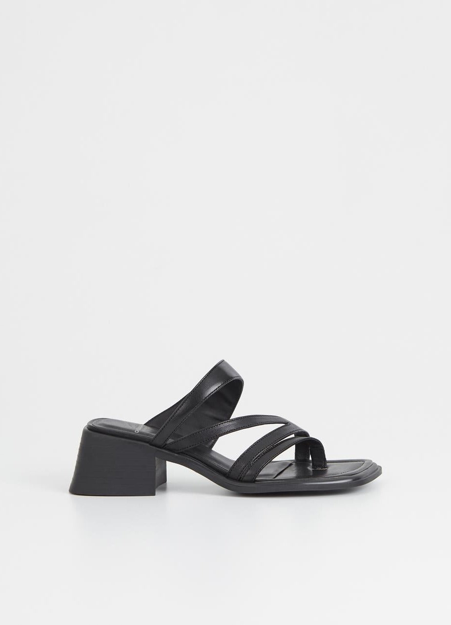 Black strappy sandals with diagonal leather straps and a splayed block heel