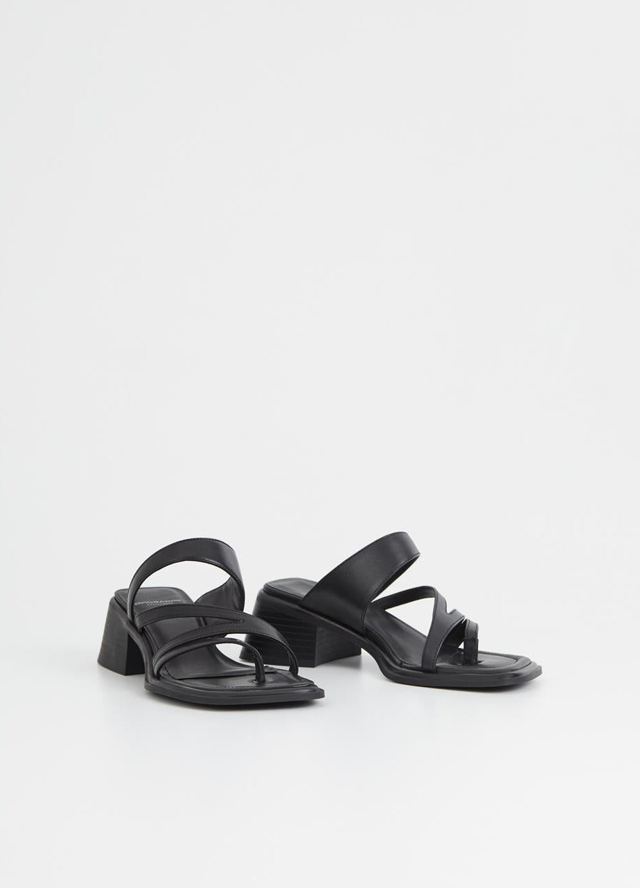 Black strappy sandals with diagonal leather straps and a splayed block heel