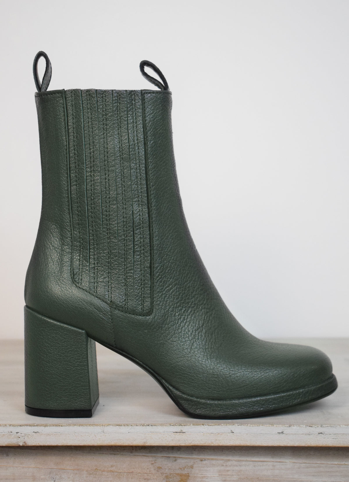 Green heeled boots