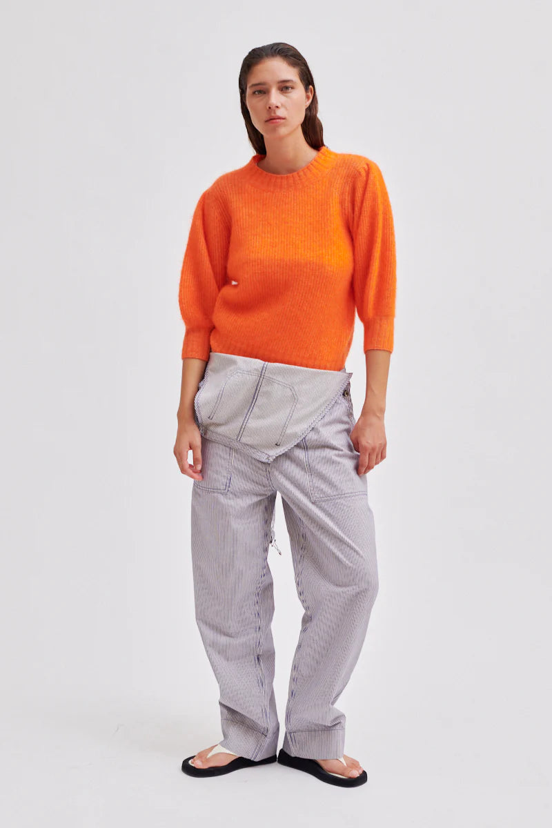 Orange crew neck jumper with short sleeves and ribbed hem and cuffs