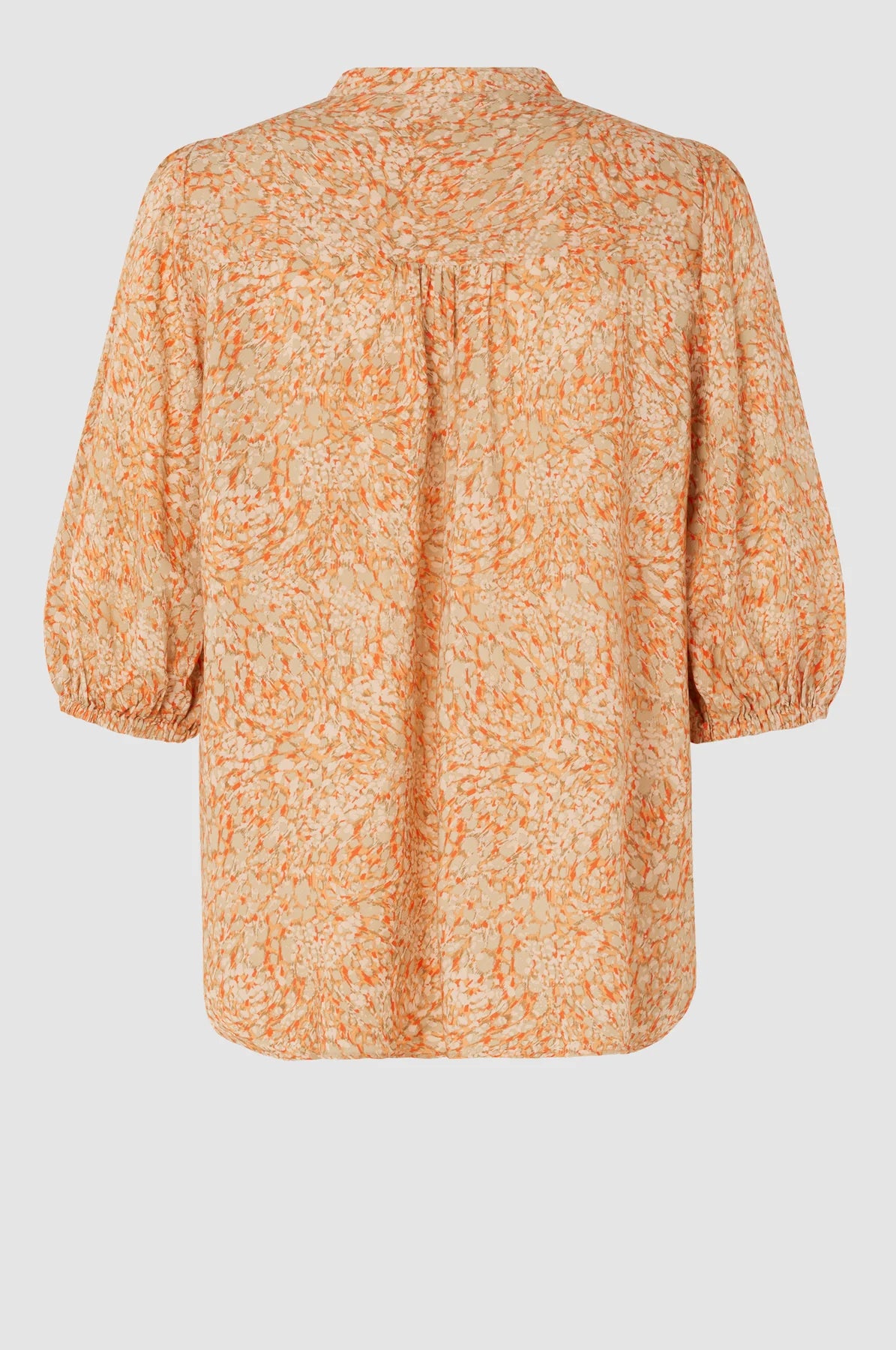 Peach and orange elbow length sleeved top with full length covered placket and elasticated cuffs