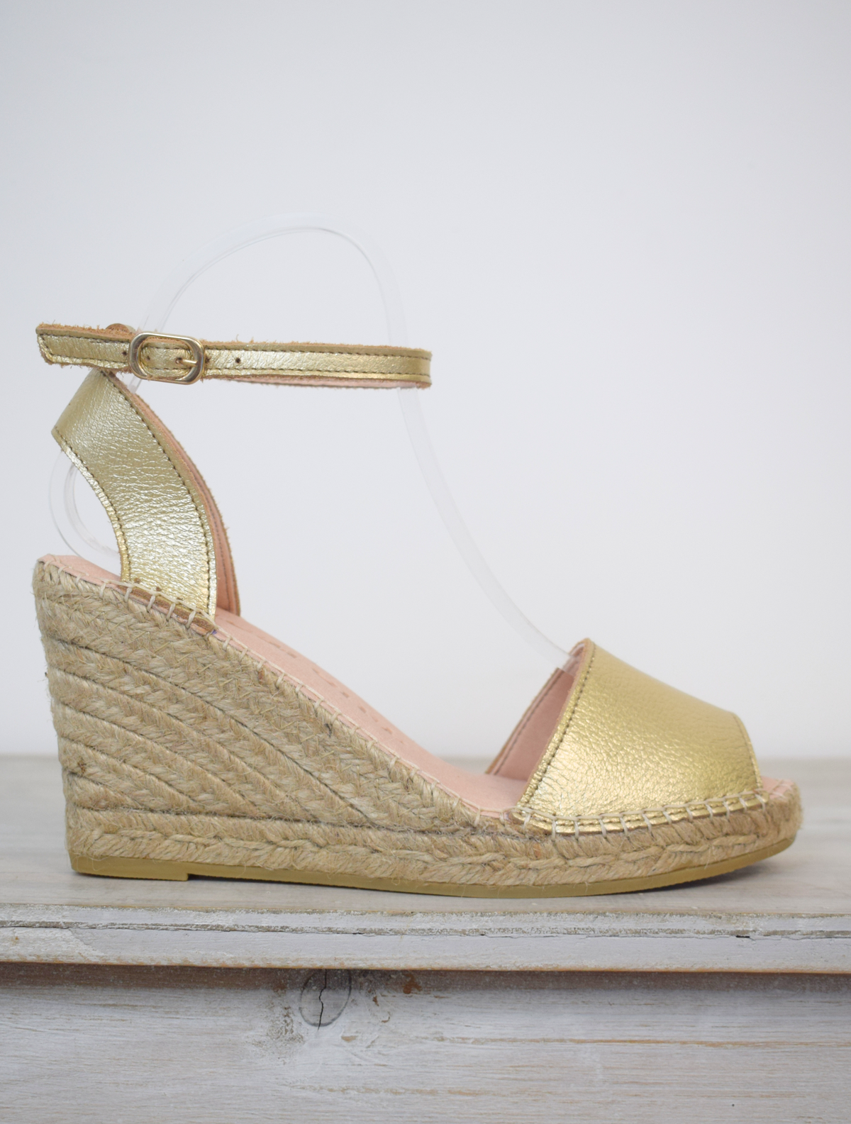 Gold high espadrille with covered toe and leather ankle strap